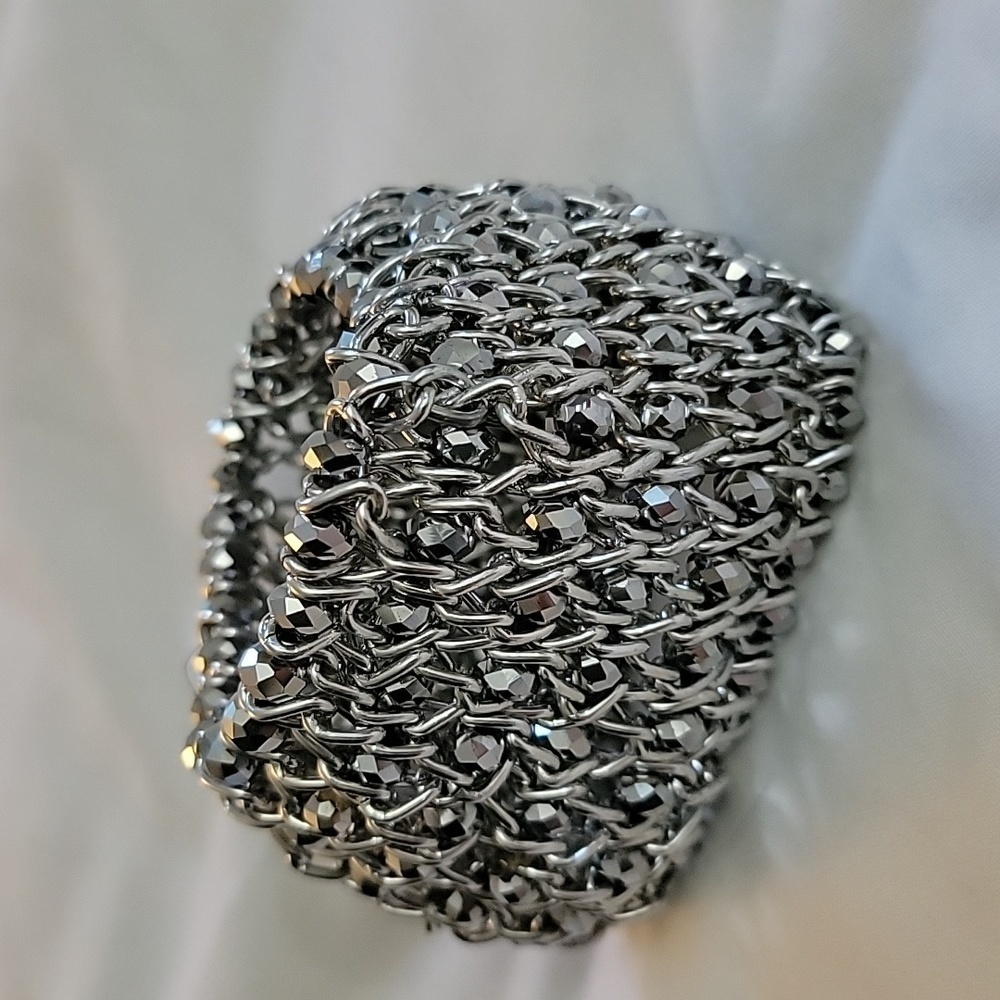 Silver colored beaded shiny cuff stretch bracelet